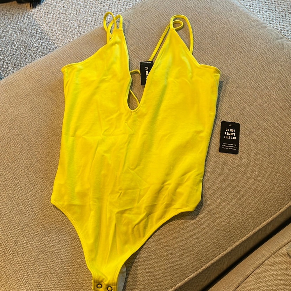 Express bright yellow strappy thong bodysuit. Size M. Snap closure